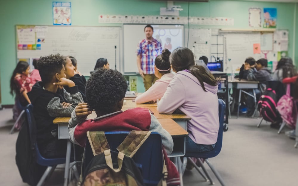 teacher in front of class of students